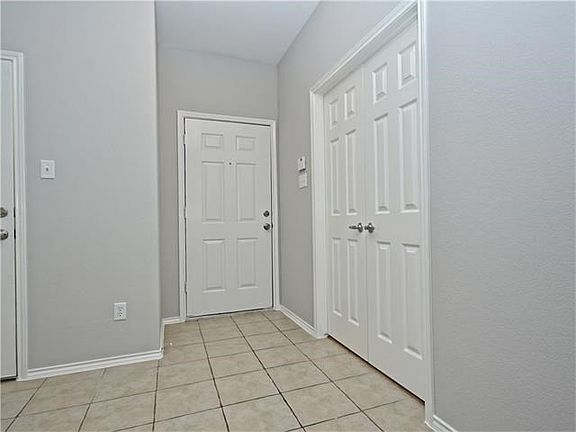 Foyer, front door, and double doors to the study