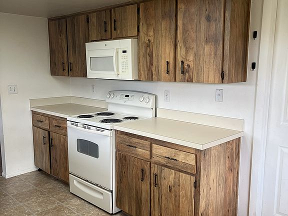 Kitchen with door to/from garage.