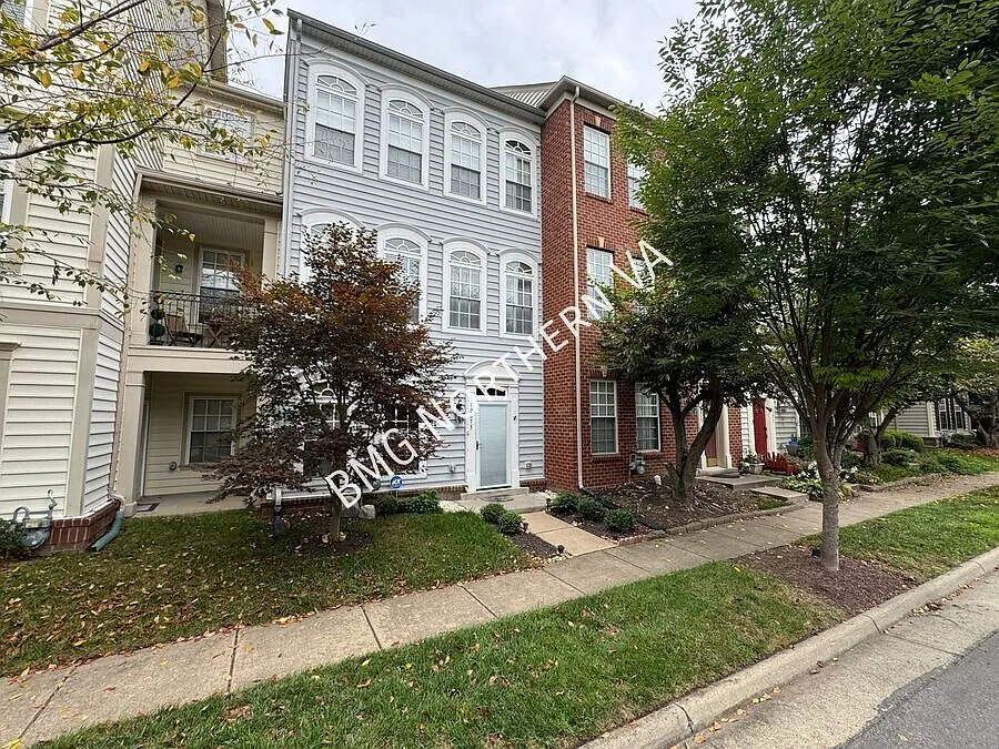 Coming Soon Spacious 3-Level Townhome with 2-Car Garage & Community Amenities in New Bristow Village — Photo 2