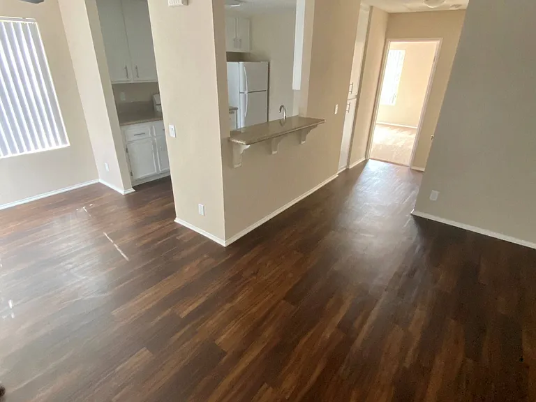 Open floor plan showing living room, dining room and kitchen area at Grande Vista Apartments.