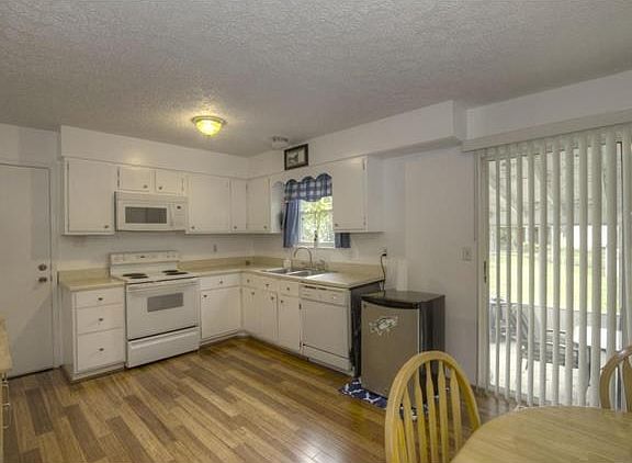 Kitchen with Sliding glass door to backyard
