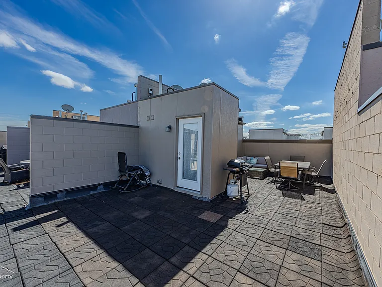 Rooftop deck with grill and patio furnature