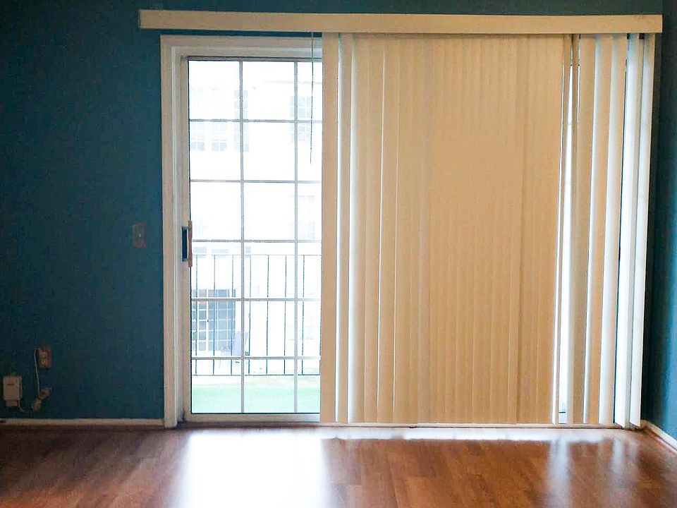 Living room with lots of natural light, fresh paint, and new blinds
