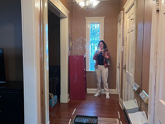Entrance hall with large mirror.