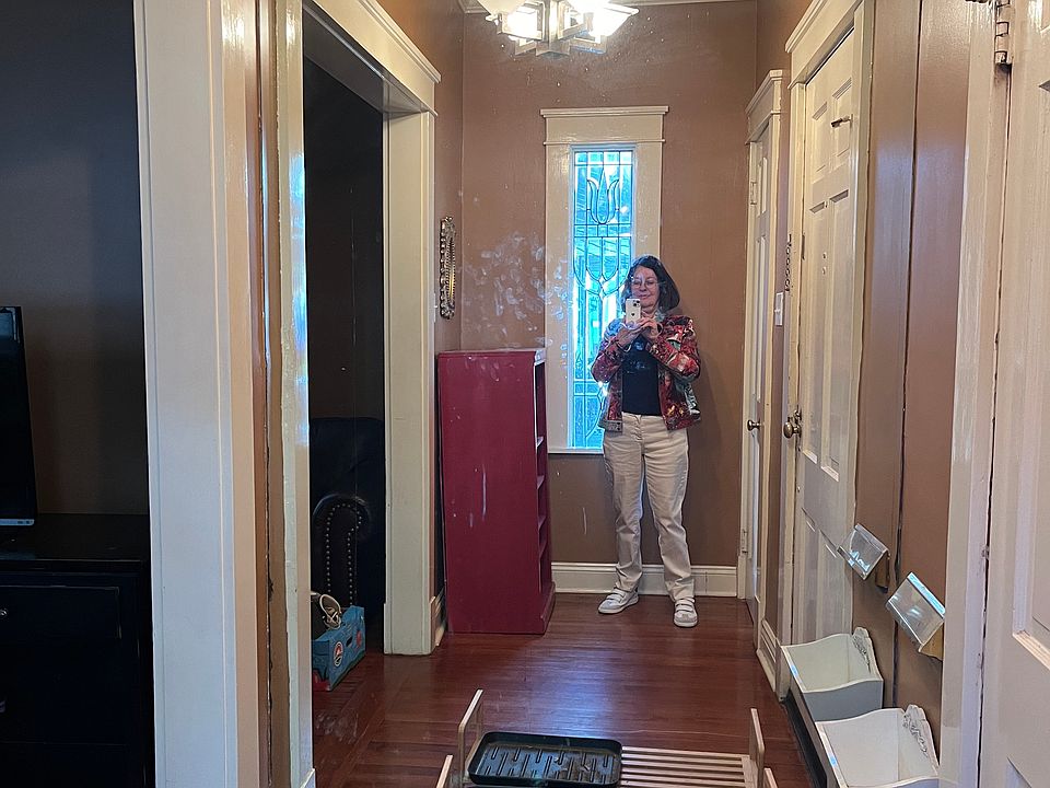 Entrance hall with large mirror.
