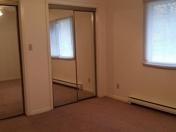 Bedroom with mirror closet doors