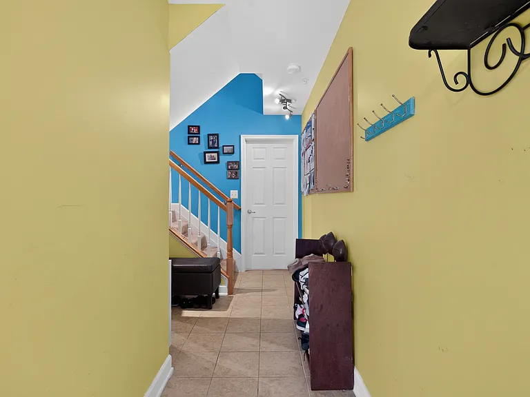 Foyer (door to basement, stairs to living room)