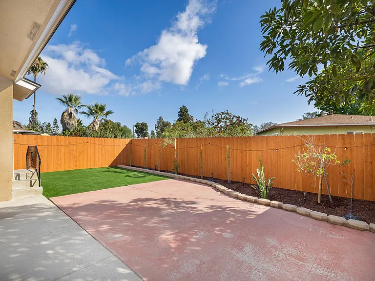 Newly installed, freshly stained private fence.