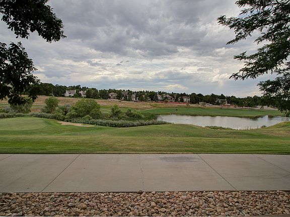 View from the lower patio of the walking path and lake at the 6th hole