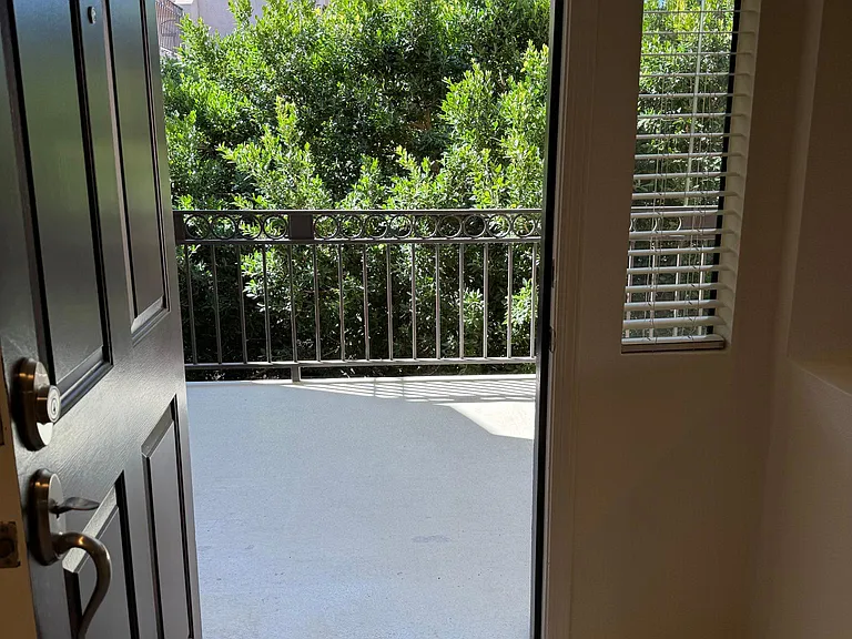 Walk out the front door to a tropically landscaped and green paradise, as well as privacy and safety. Put a chair or two outside to enjoy the exterior space.