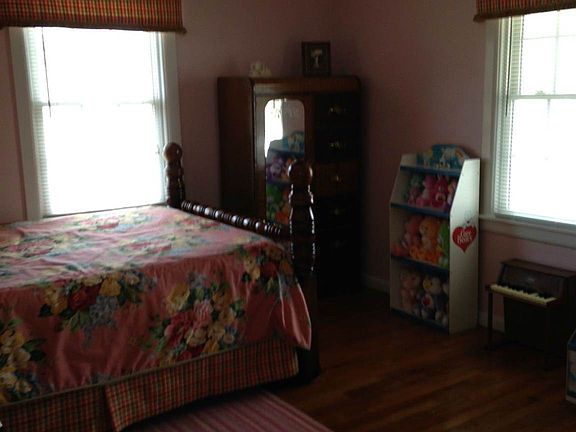 Spacious Guest Bedroom-wood floor