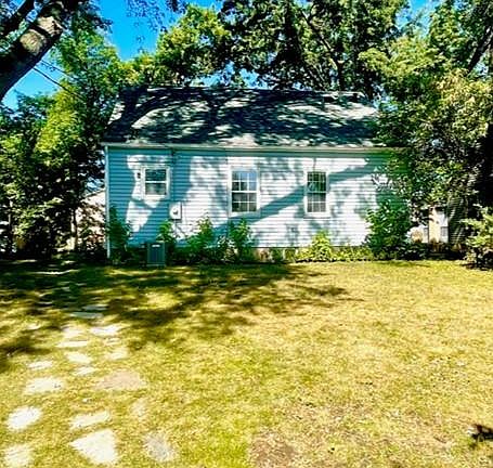 Rear of subject home and back yard