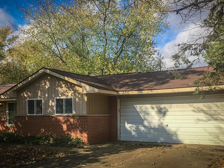 Front of house with two car garage