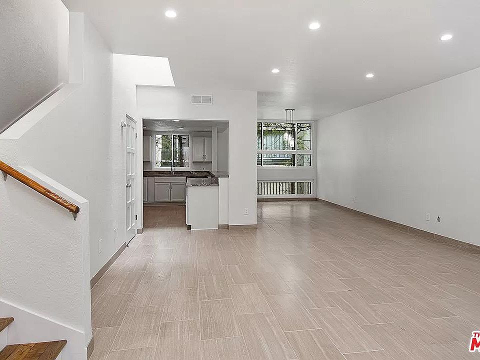 Upon entry into the Unit, you see an Open Floor Plan with Living Room, Dining Room, and Kitchen.