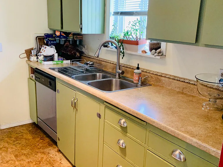 Nice bright kitchen with lots of cabinets.