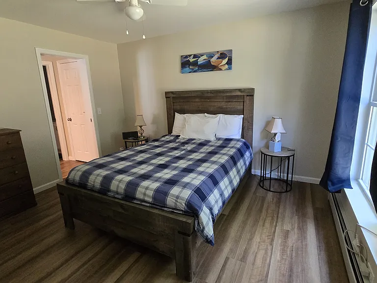 Queen bed on 1st floor with adjustable base.