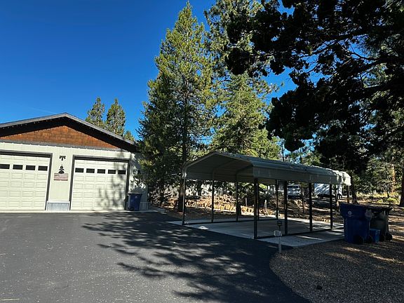 Covered parking in the front of the house.