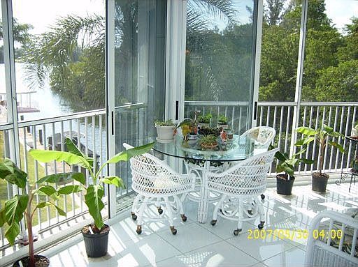 enclosed hurricane impact glass patio with waterviews galore