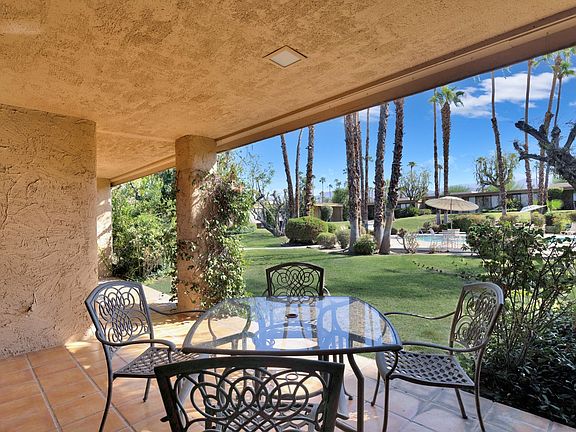 rear patio looking out to pool/spa and grounds