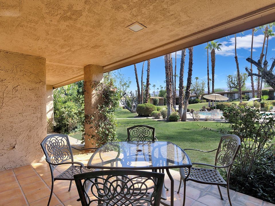 rear patio looking out to pool/spa and grounds