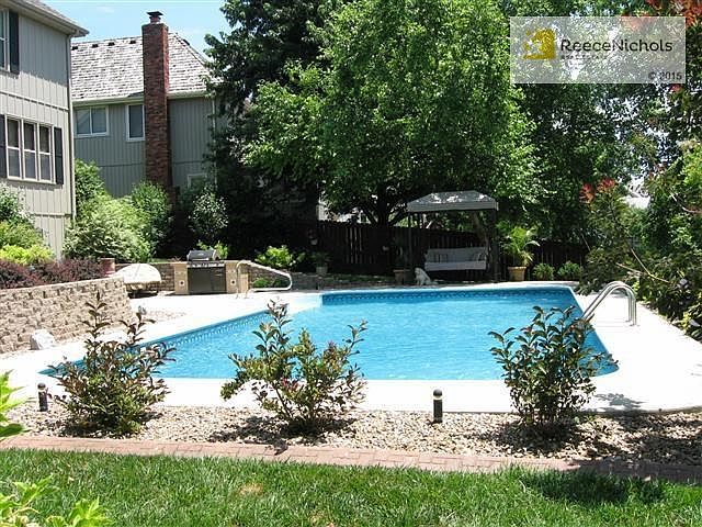 Beautiful backyard with oversized heated pool! Notice the outdoo