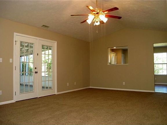 Family Room: Offers Cathedral Ceilings & French Doors leading to Screen Porch.