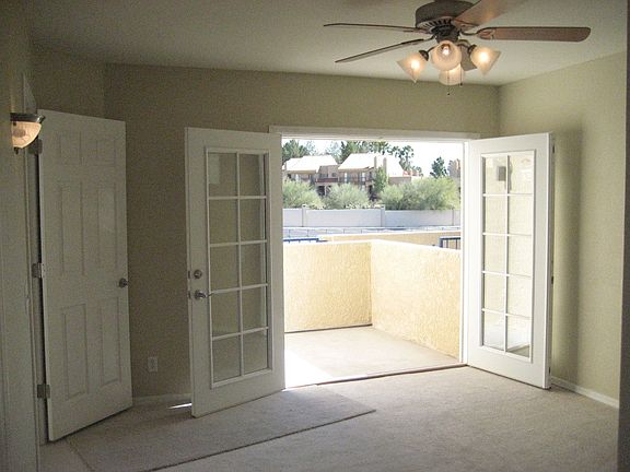 2X French doors open to one of two patios with mountain views. New carpet.