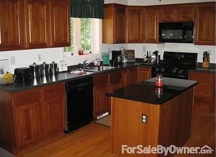 An Open Kitchen
						:
						This is the greatest open space for entertaining or watching kids while cooking.