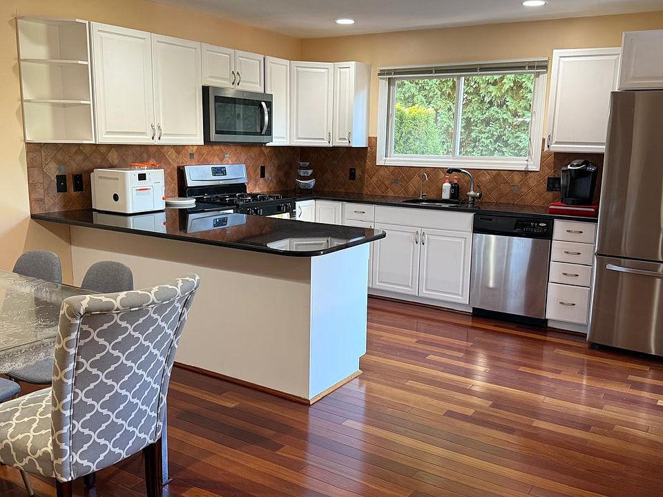 Updated kitchen with modern appliances and ample storage.