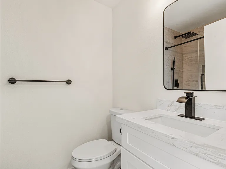 Brand-new modern bathroom with shower on the main floor.