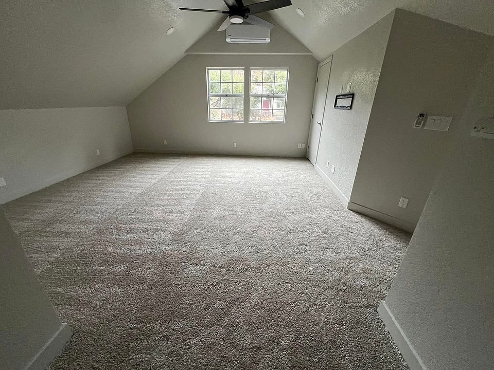 Upstairs living room with storage room on right side.