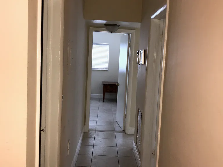 view of hallway to bedrooms from dining room
