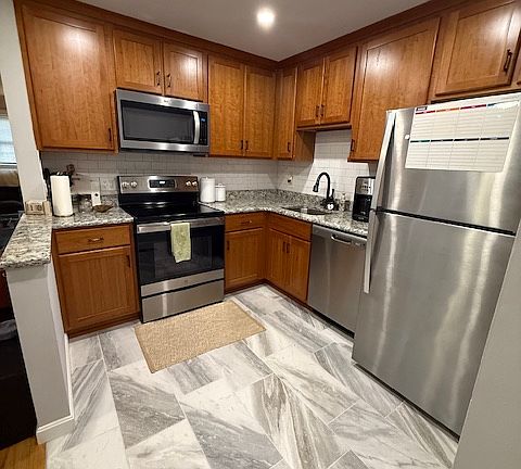 Newly upgraded kitchen- lots of light and storage, tile flooring.
