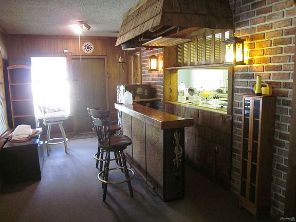 Florida room with Bar, opening to living room and another to kitchen and backyard