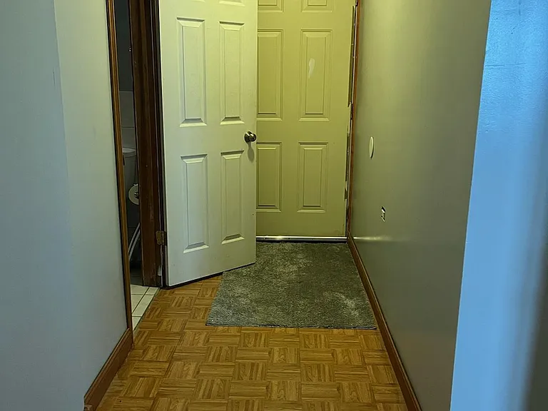 Hallway to back lower door.