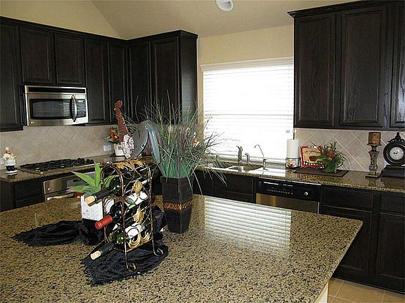 Another look at the kitchen showing off the ample storage and generous size!