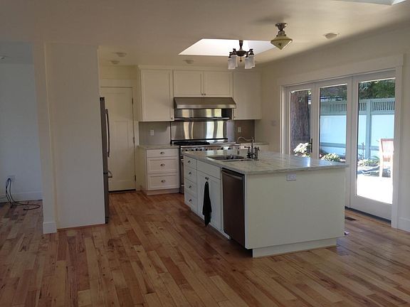 Practical chef_s kitchen with high-end appliances chosen for their reliability and functionality - Capital Stove with wok burner and two ovens, Bosch dishwasher that has been a Consumer Reports best buy for a decade, a professional grade Insinkerator garb