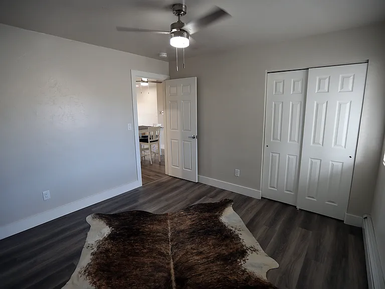Spacious bedrooms with large window for natural light, full size closet and ceiling fan