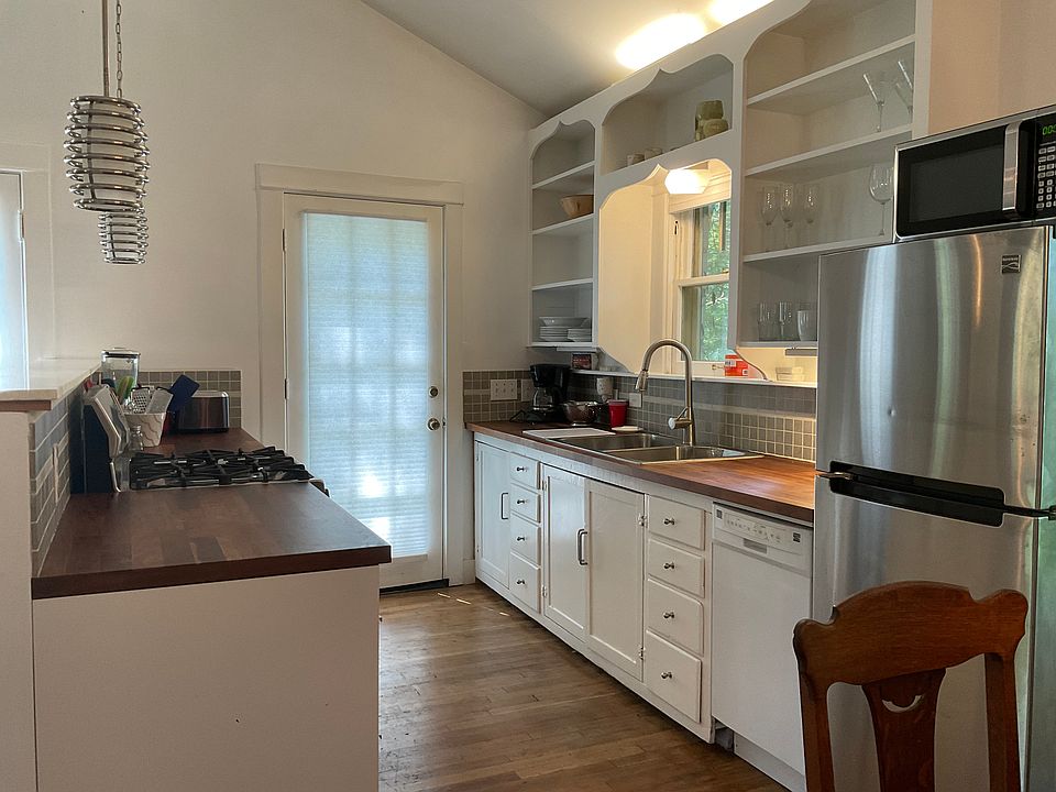 Kitchen with second door out to the deck.