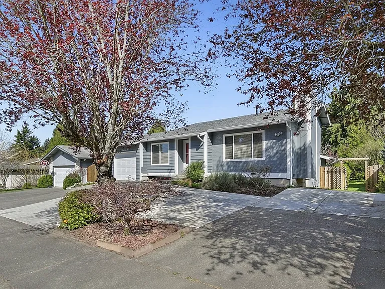 Front of home with extra parking spaces.