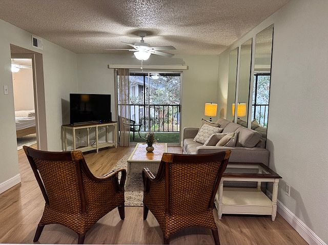 Living room overlooking porch with pond view.