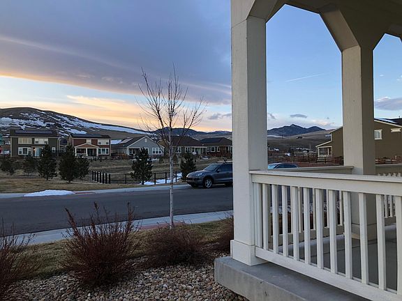 Gorgeous view of foothills from front porch . Ideal location with open space across the street...view will never be obstructed!