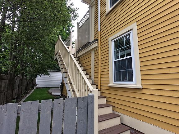 Outside staircase to the Unit 2 deck and back entrance.