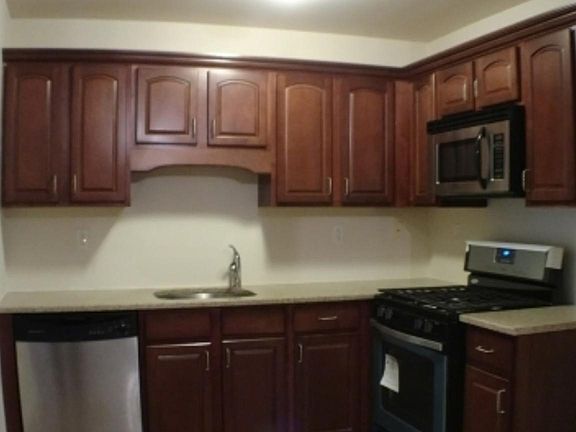 Kitchen with granite counter tops & updated custom backsplas