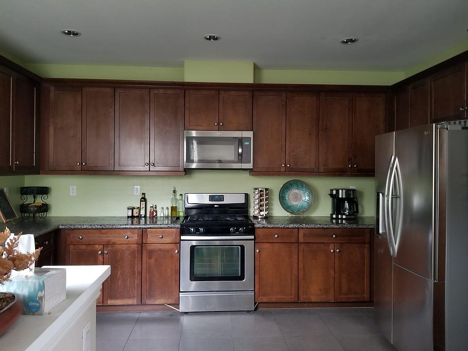 Large Open Kitchen with Stainless Steel Appliances