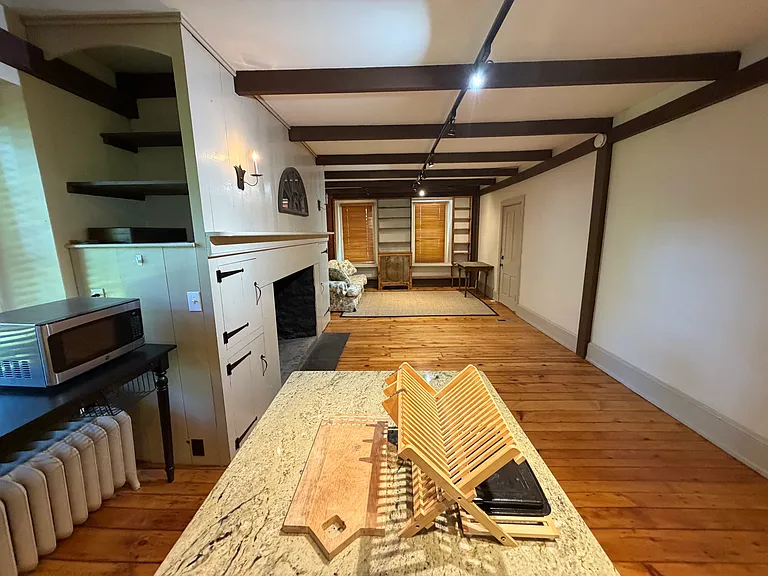 Kitchen Island looking into Living Room. Seating at Kitchen Island, no need for a dining table