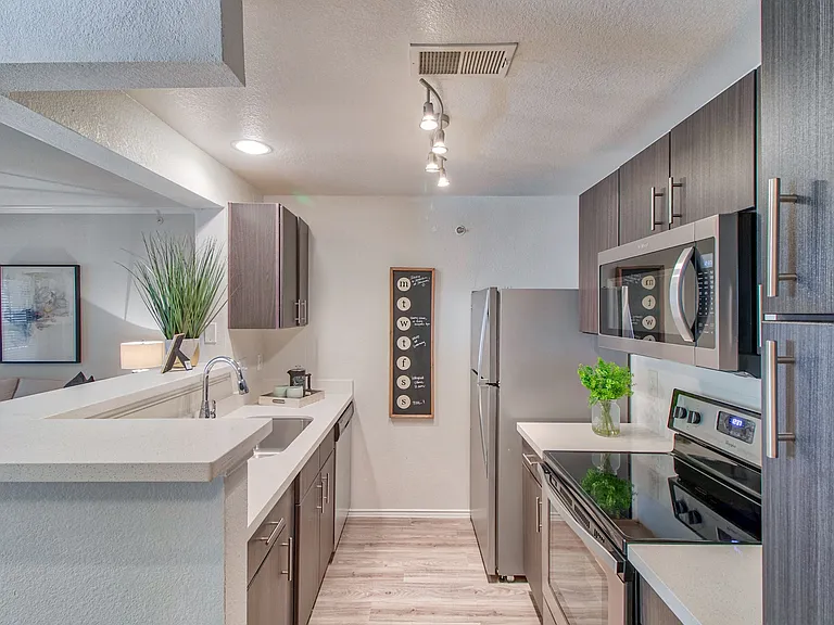 Kitchen with Espresso Cabinetry and Stainless Steel Appliances