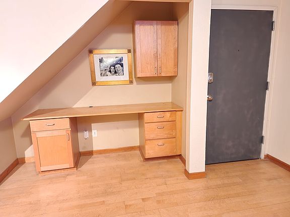 Built in desk. Commercial steel door and frame with electronic lock.