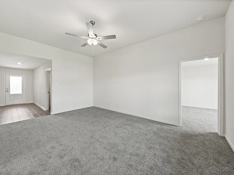 The spacious family room has plenty of room for furniture.