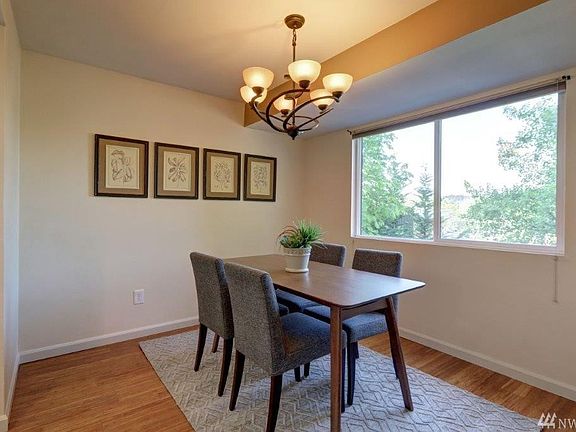 Dining area with new interior paint and classy light fixture! Bottom up - Top down custom shades too!